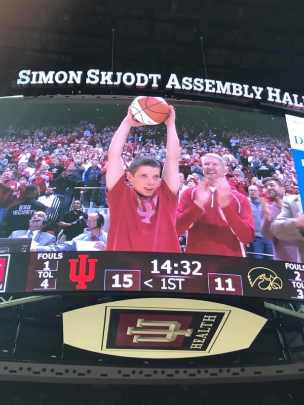 Malachi holding the game ball