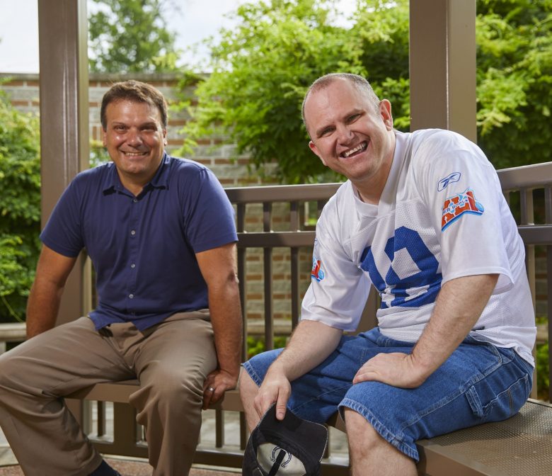 Adult Male and Male Client Smiling