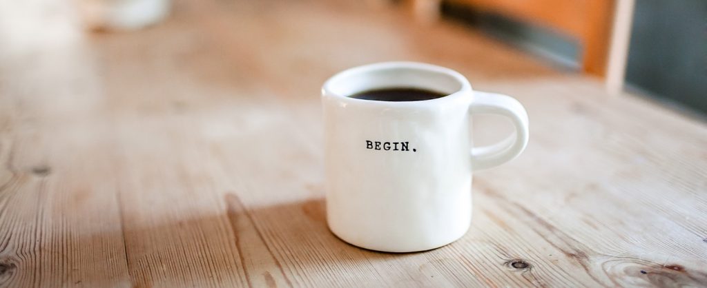 coffee mug with the word begin on it