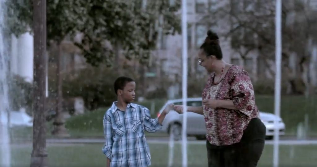 Adult female walking with young male