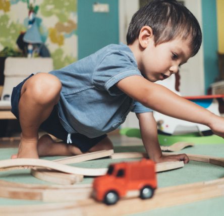 male client playing with toys