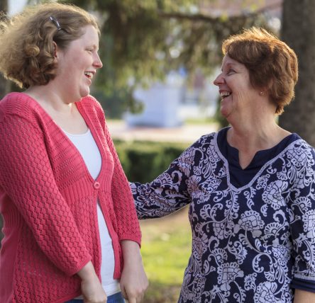 Daughter smiling with mother