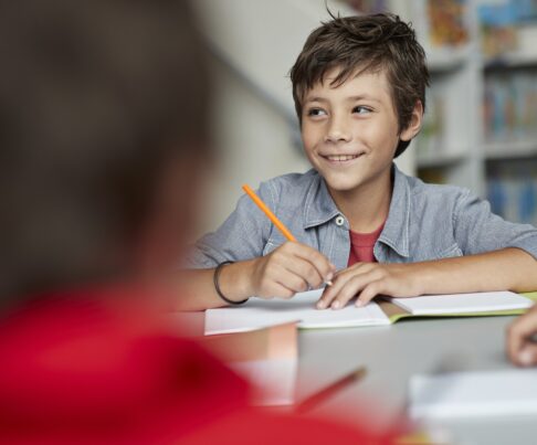 young boy doing school work