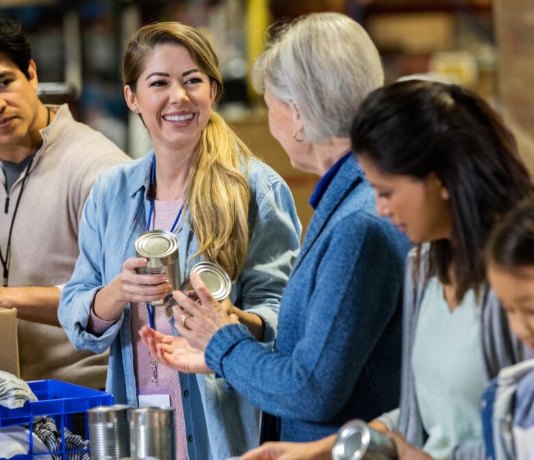 Volunteers sort through canned items