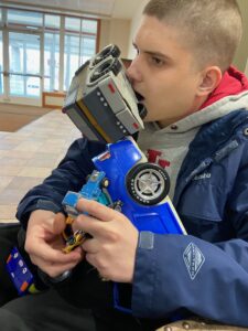 Jacob holding toy cars