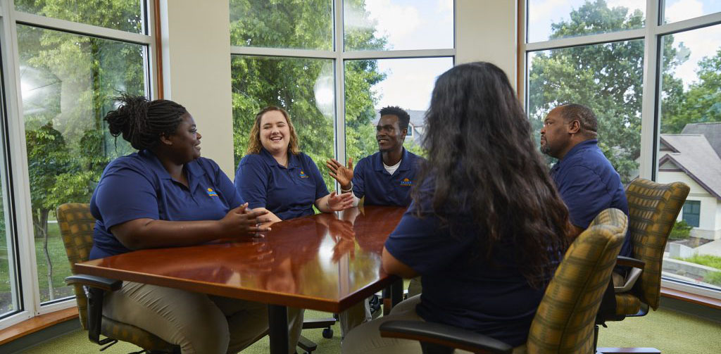 Damar staff sitting together