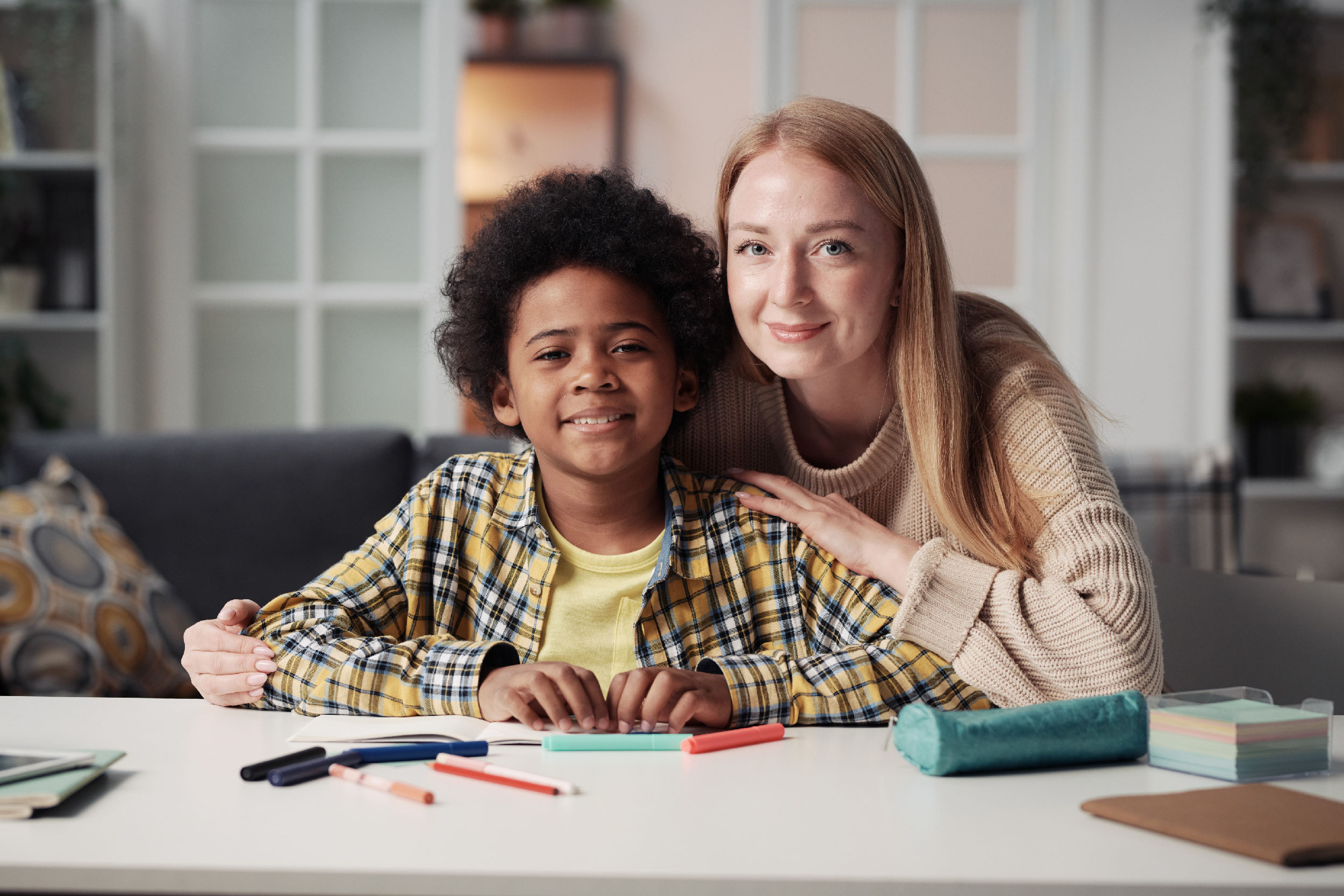 Foster mom and son smiling