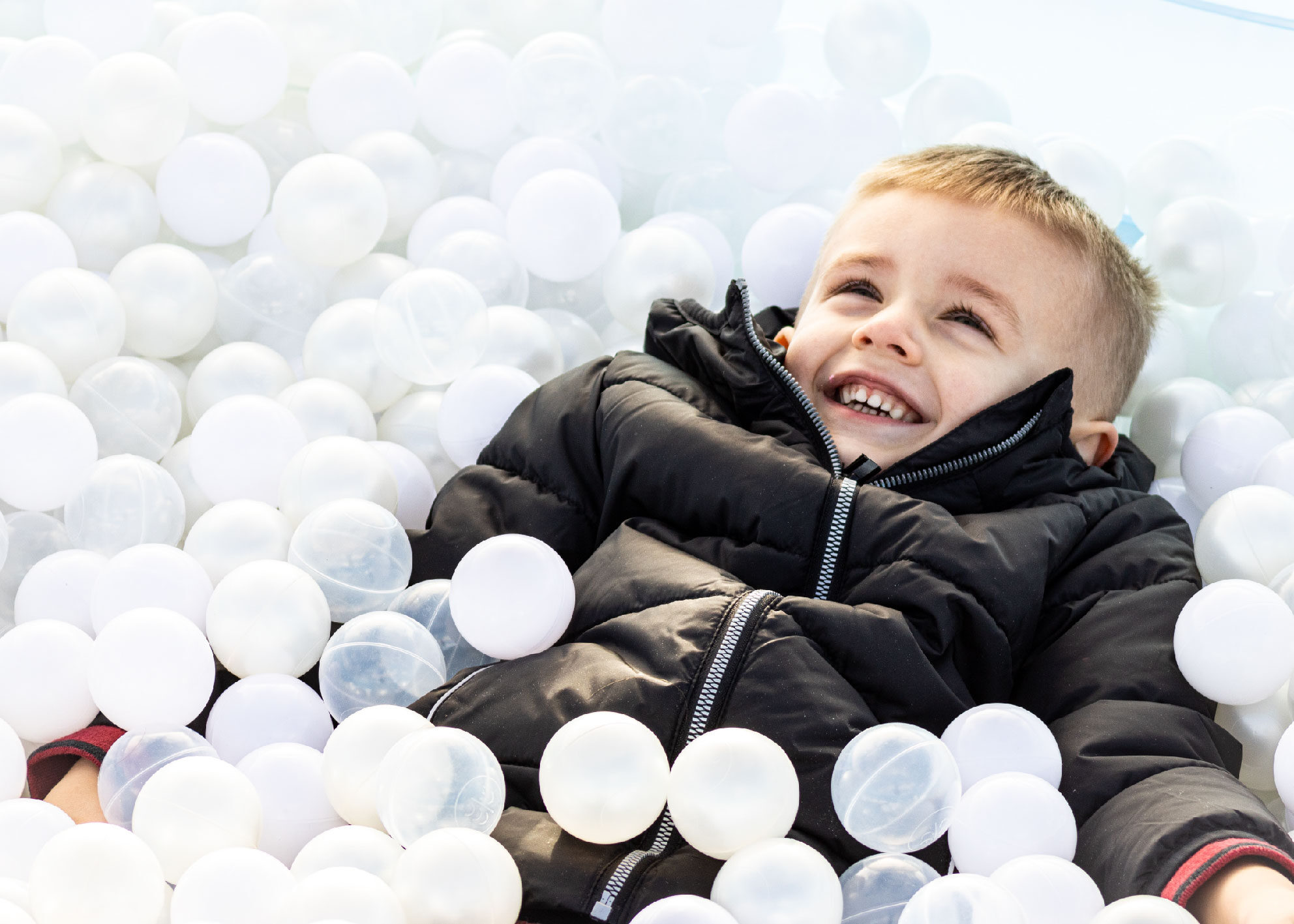 boy in ball pit