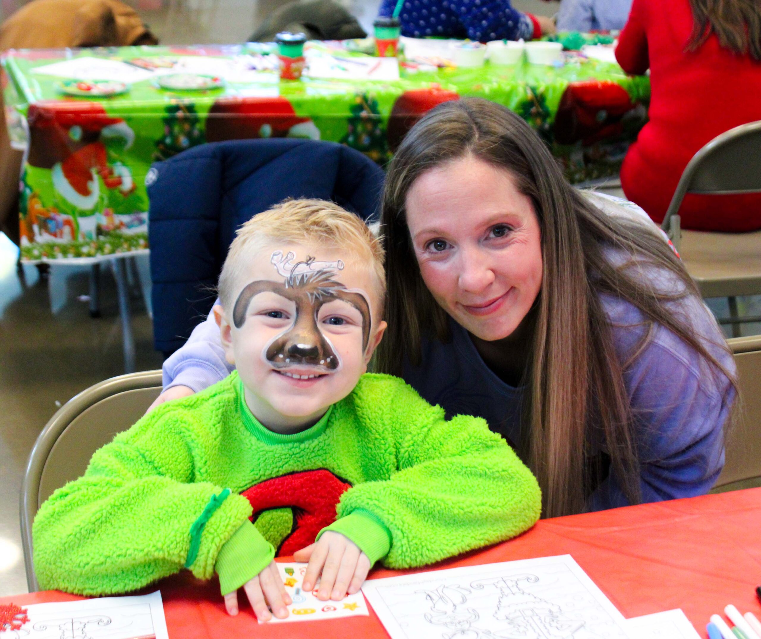 boy with autism wearing grinch costume