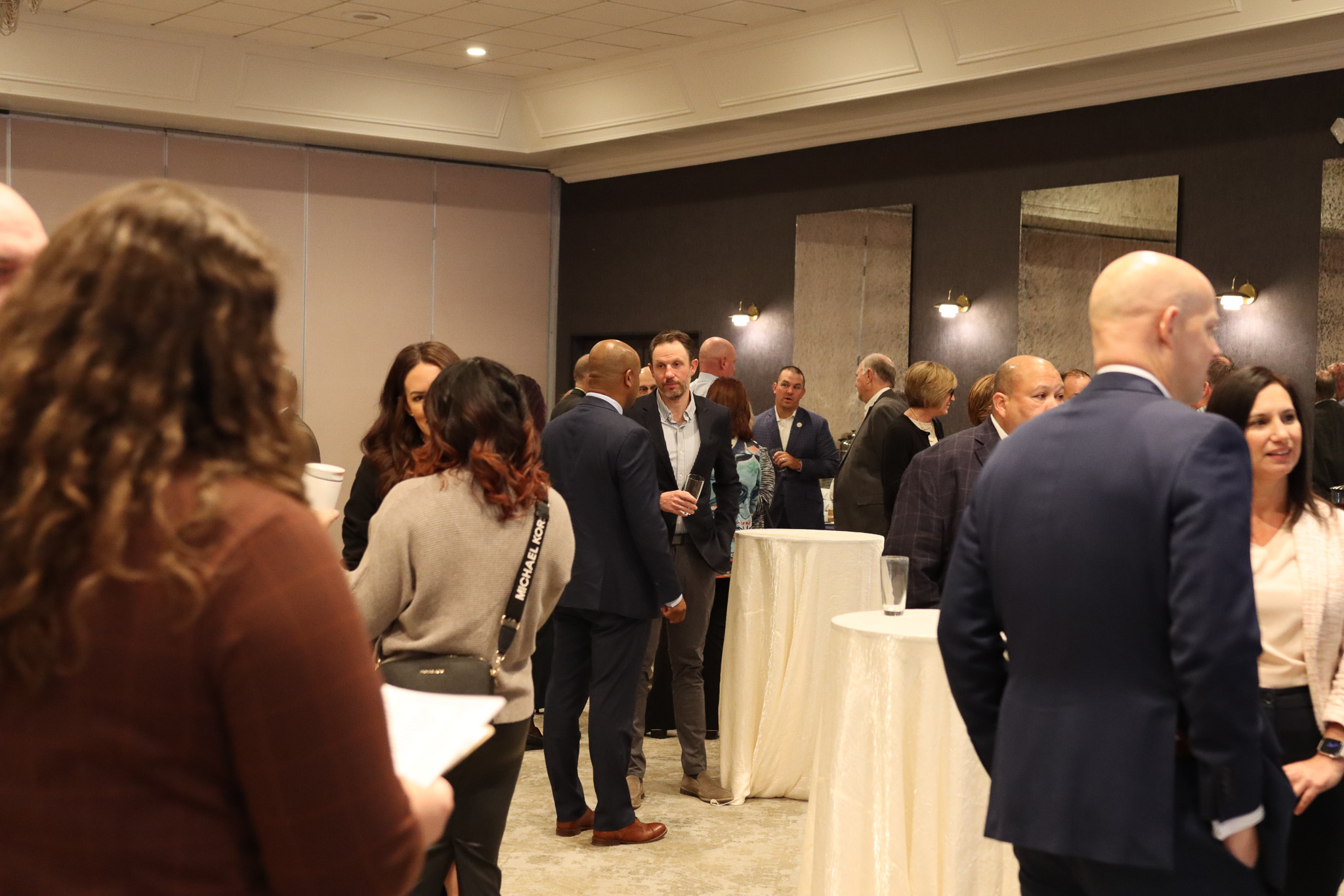 Guests gathered around tables at a community event