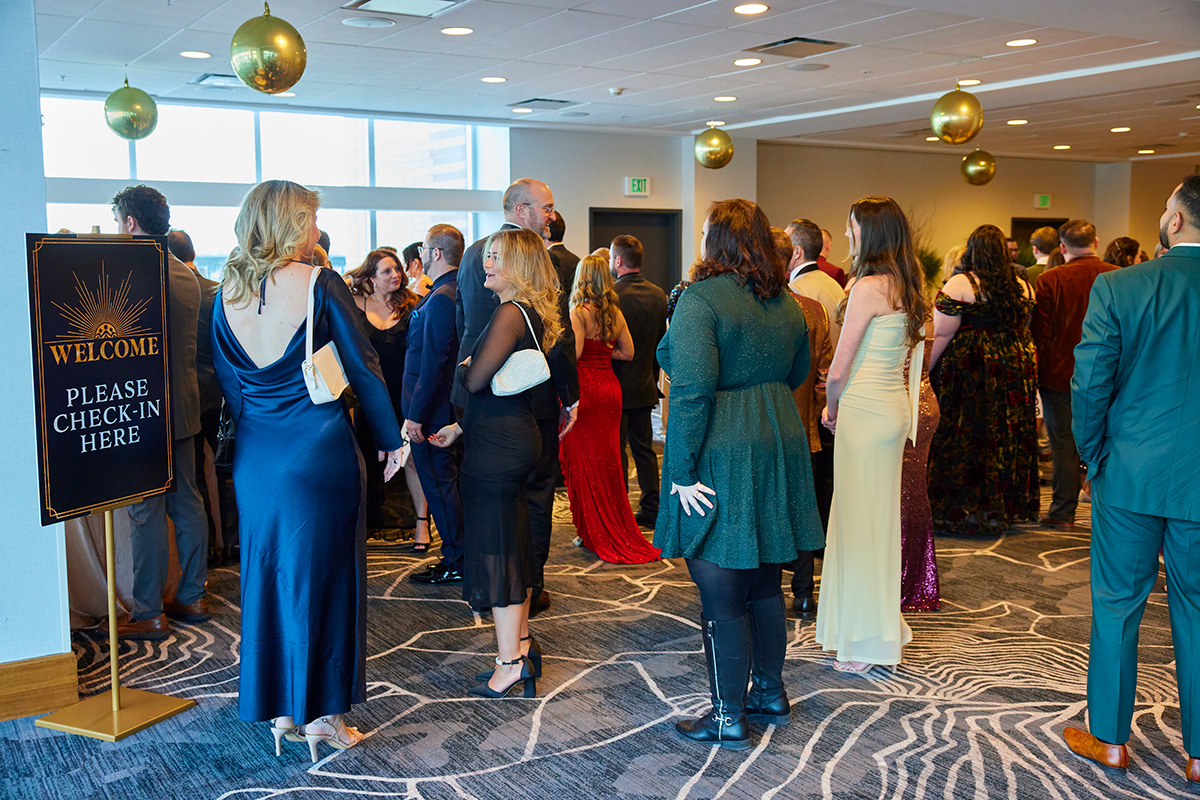 Guests arriving and checking in at a past Damar gala